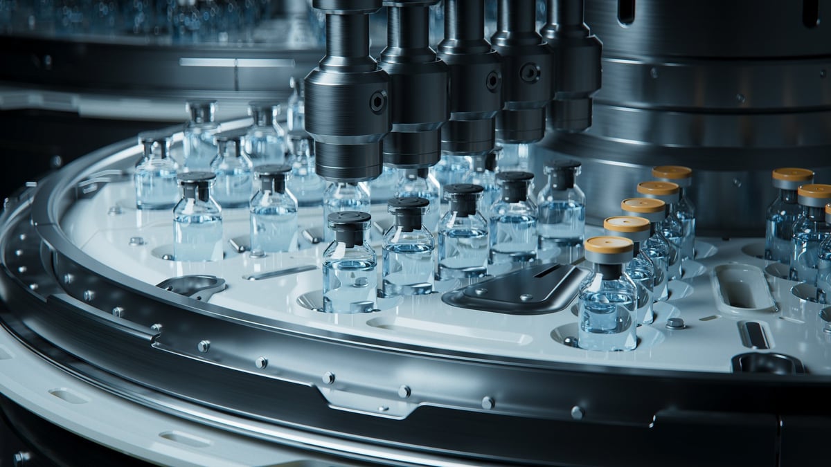 High-tech pharmaceutical production assembly line with bottles and vials being processed at high precision in GMP certified facility