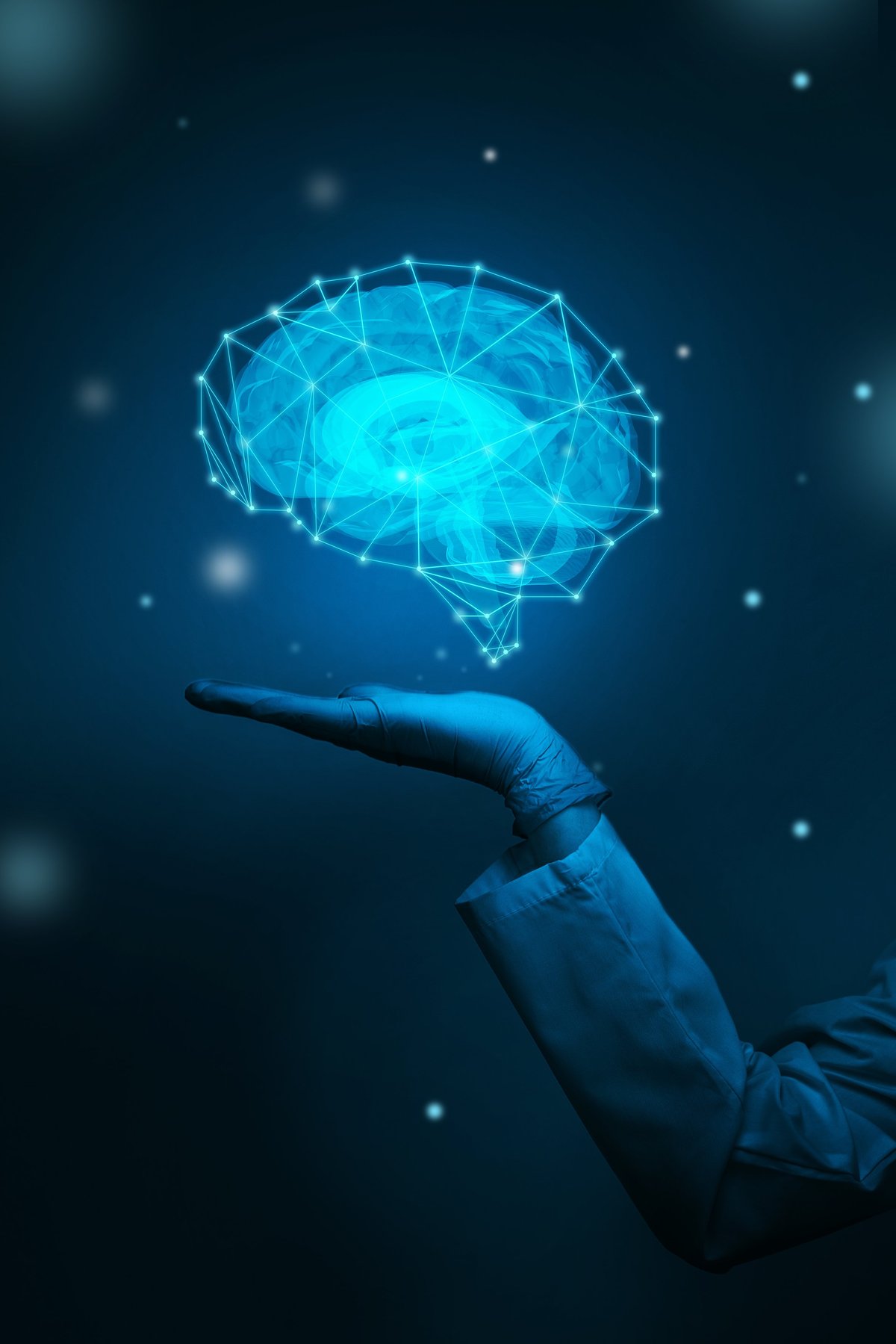 A hand in a glove supports a glowing blue brain with abstract connections in a dark background representing neuroscience and cognitive enhancement