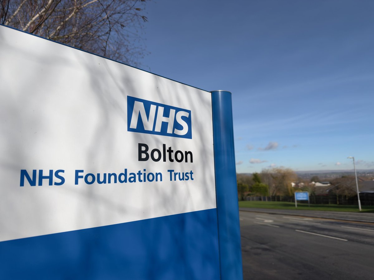 NHS hospital entrance sign showing the National Health Service branding